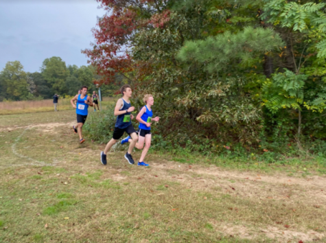 Sophomore Mason Hughes, Junior Mark Vorster, and Junior Will Taliaferro compete in a club meet at Pole Green Park. Photo courtesy of: Mason Hughes