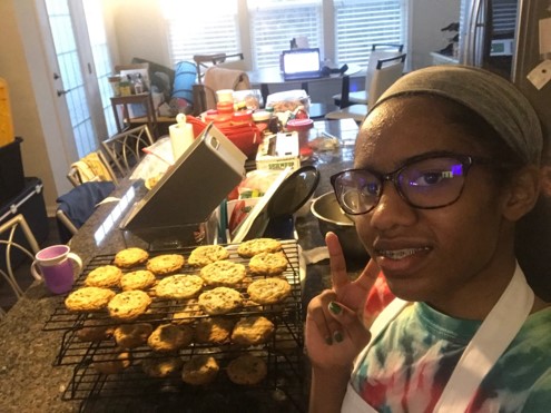 Freshman Kylee Theodore posing for a photo with her cookies for the cookie project.