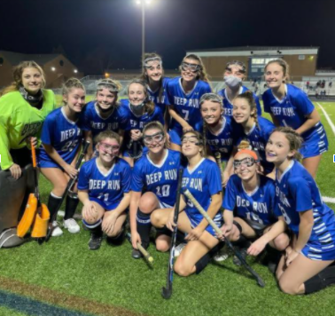 The field hockey team celebrates after a 7-0 win against Freeman