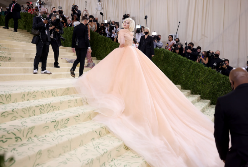 Billie Eilish attended and co-hosted the Met Gala. Her dress was incredible. Eilish looked as if she was a Disney princess. She was wearing an Oscar de la Renta gown with Cartier jewelry. Interestingly enough, her gown is fur-free to support her vegan stance on society. Eilish made a deal with Oscar de la Renta to better the brand itself. She promised to wear their dresses if their brand became fur-free. With this, the brand accepted her idea and became fur-free. This outfit would be my second favorite, the gown is gorgeous. I would absolutely wear it.