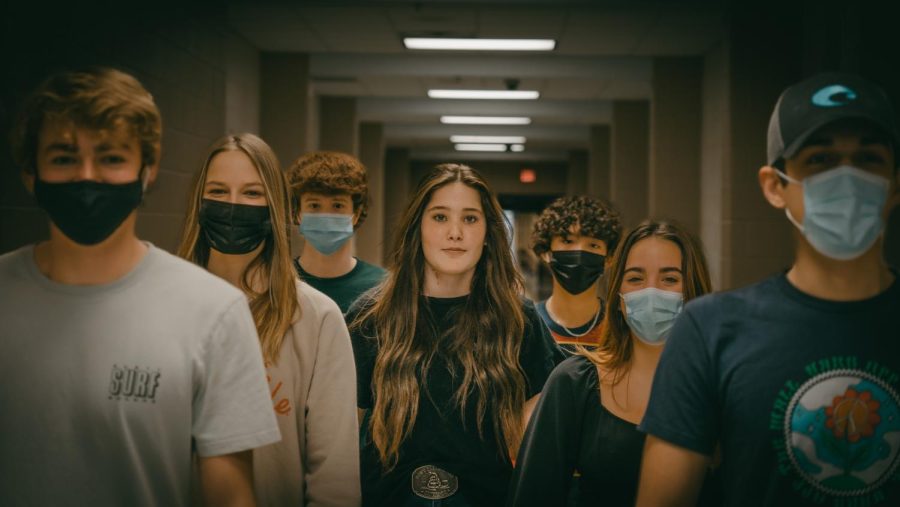 Freshman Ella Hastings poses among masked students.