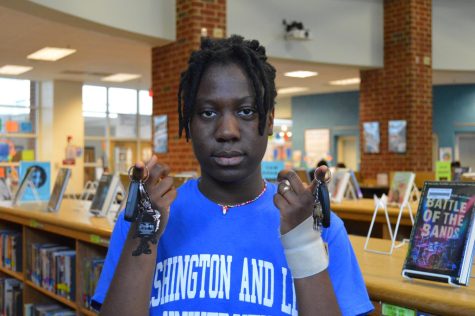 Senior Isis Keneah poses with drivers car keys in the library.