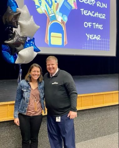 Teacher of the Year Melissa Daniels poses with Principal Brian Fellows upon receiving the award.