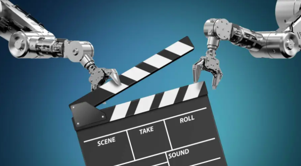 An image of robotic arms toying with a clapperboard. 