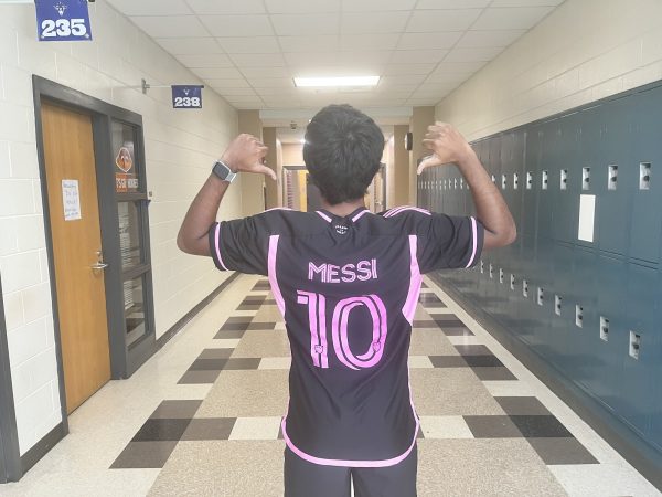 Junior Rahid Saker shows off his black and pink Inter Miami jersey.