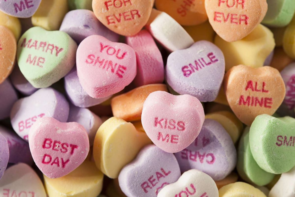 Heart shaped candies with words on them are a popular Valentines tradition. 