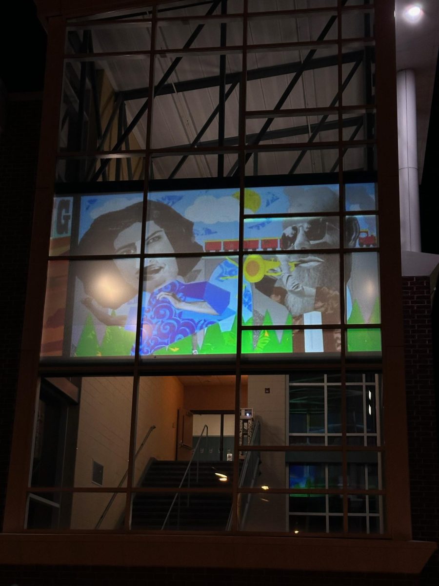 Students’ artwork projected onto the front windows of the school.