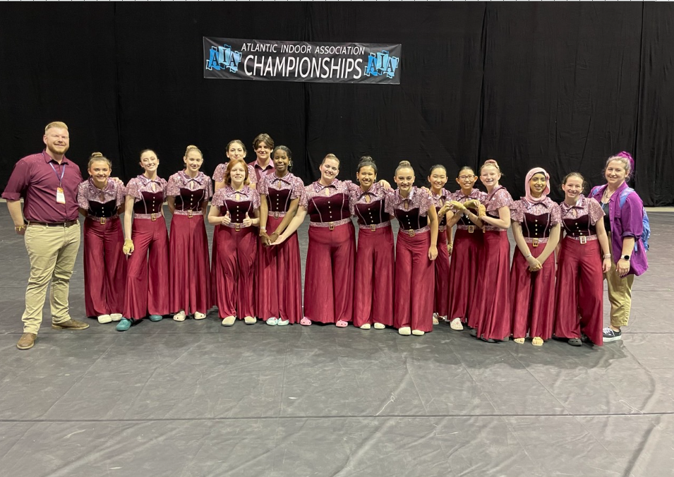 Winter guard team poses for photo at AIA championship.