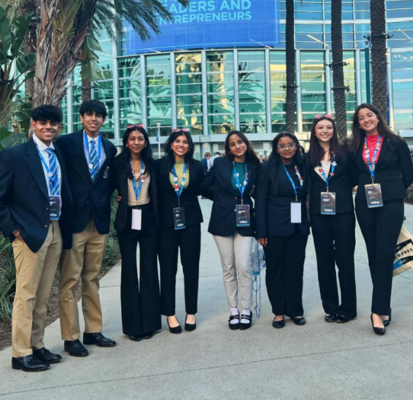 The DECA team poses for a photo outside the Anaheim Convention Center.