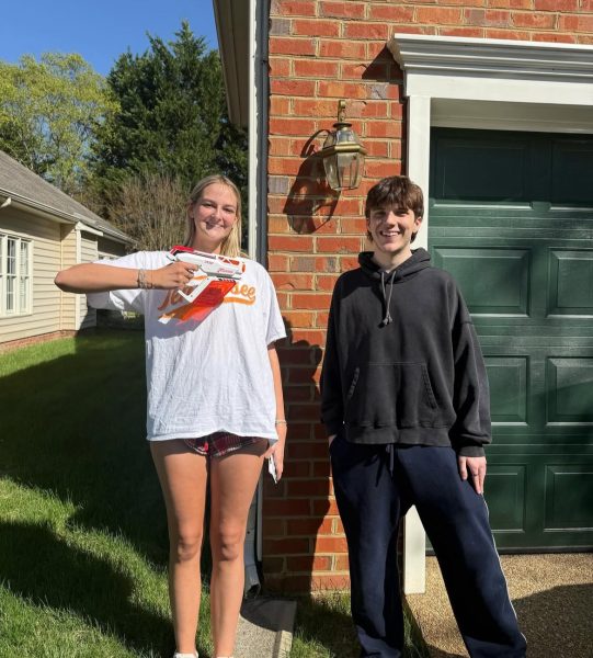Senior Spencer Strong gets her target, senior Arthur Demao, out at his house. (Photo courtesy of Deep Run Senior Assassin Instagram)