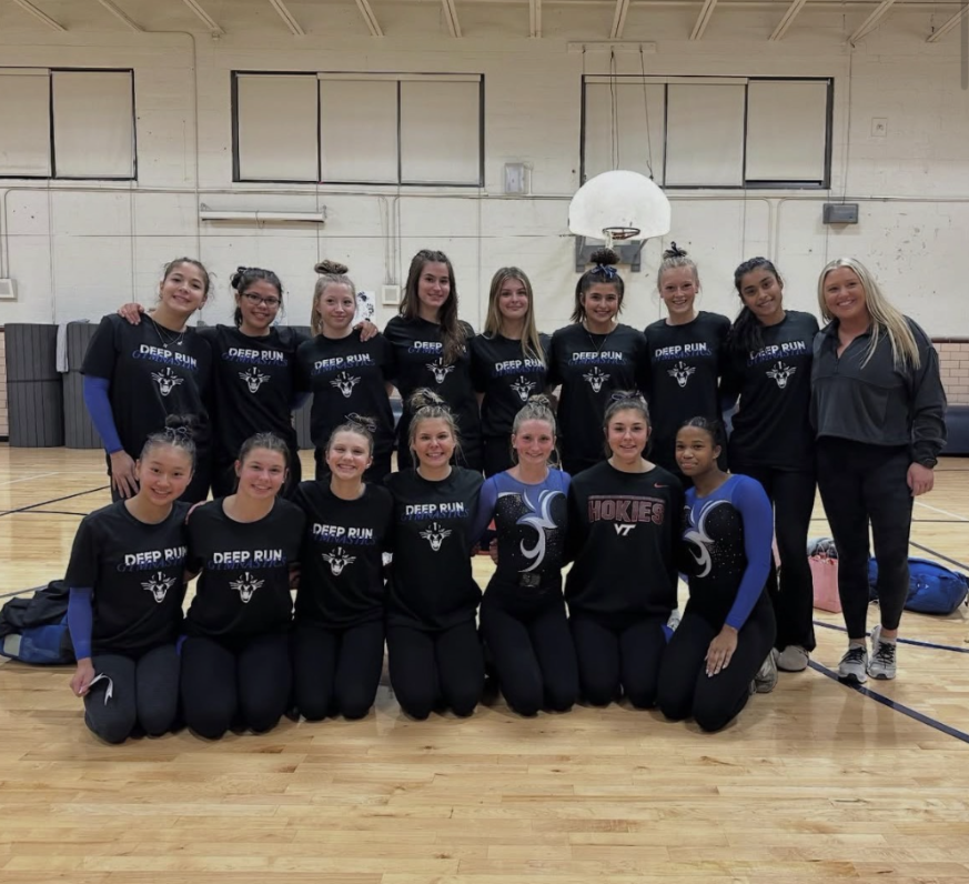 The gymnastics team supports each other as a team.

