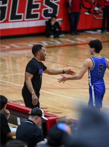 Head coach Bibby and senior guard Cooper Hallam during their game against Godwin high school.