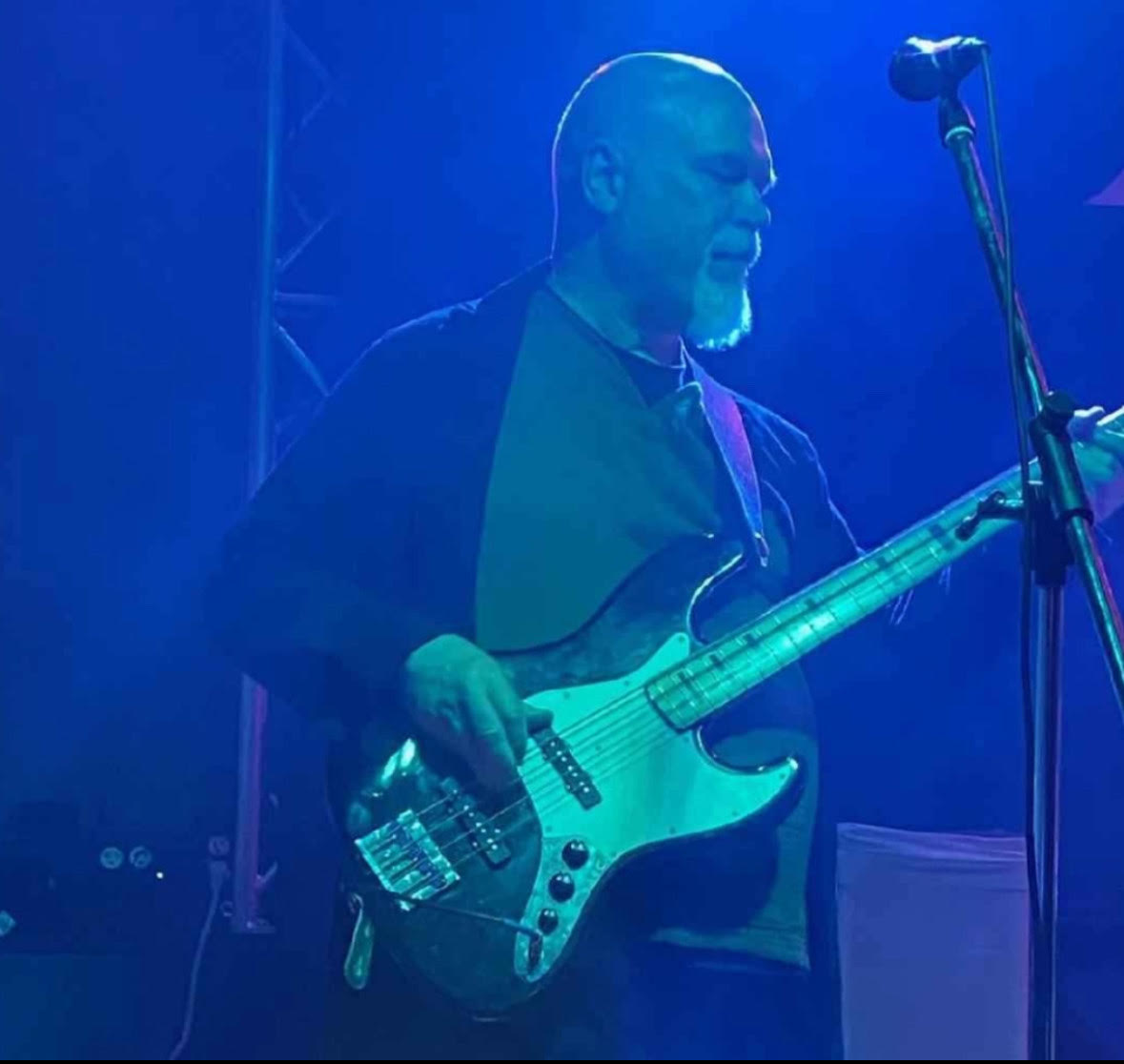 Penland plays bass live with one of his bands.